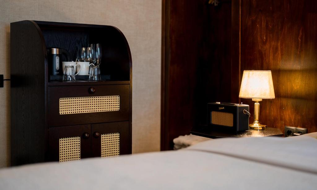 Postel nebo postele na pokoji v ubytování Communal Hotel Kutaisi