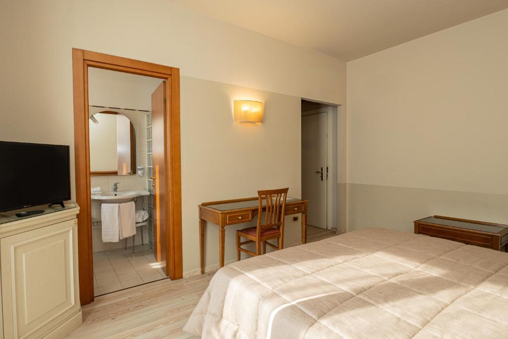 TV a/nebo společenská místnost v ubytování Hotel Valentino