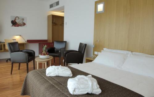 Postel nebo postele na pokoji v ubytování Executive Hotel