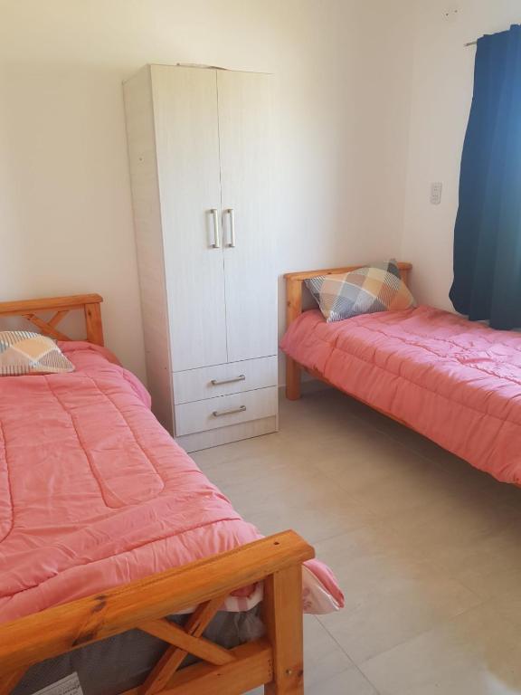 Postel nebo postele na pokoji v ubytování Complejo San Emilio