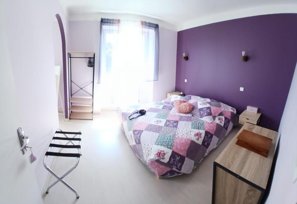 Postel nebo postele na pokoji v ubytování L'Aurigast