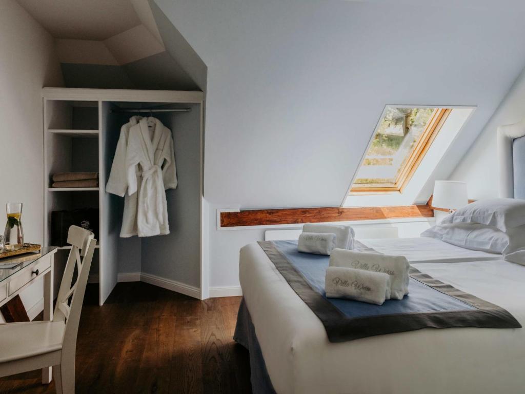 Postel nebo postele na pokoji v ubytování Villa Weiss