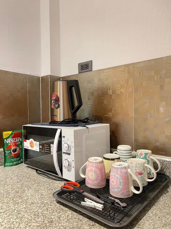 Příslušenství pro přípravu čaje a kávy v ubytování Anna Home@Lat Krabang