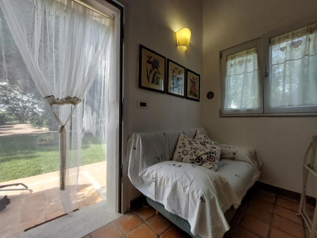 Postel nebo postele na pokoji v ubytování Agriturismo La Stornara
