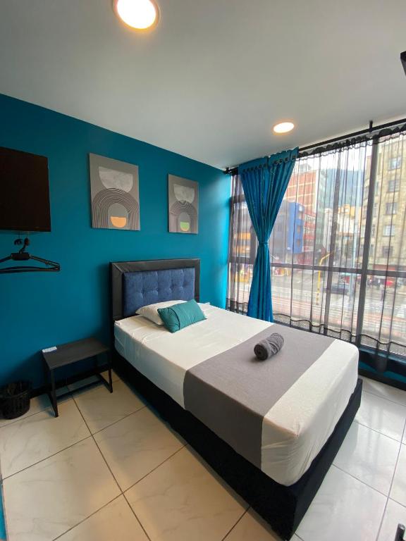 Postel nebo postele na pokoji v ubytování Hotel HILLS BOGOTA