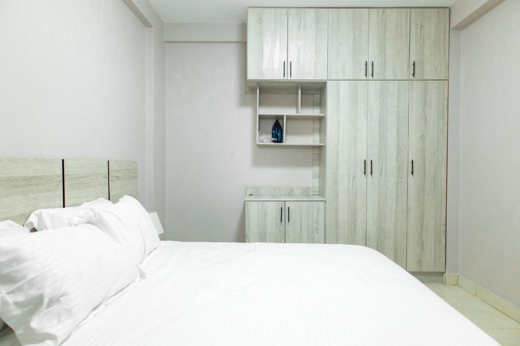 Postel nebo postele na pokoji v ubytování Fata Residence