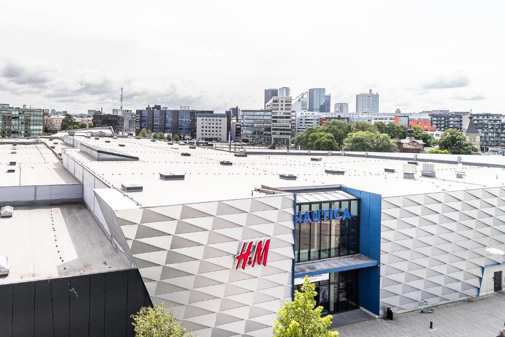 a large white building with a miami sign on it at Top floor near ferry terminal - free parking in Tallinn