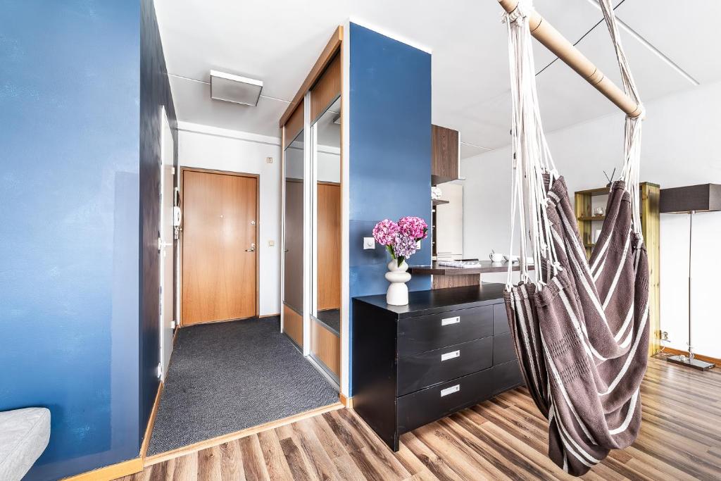 a dressing room with a blue wall and a mirror at Top floor near ferry terminal - free parking in Tallinn