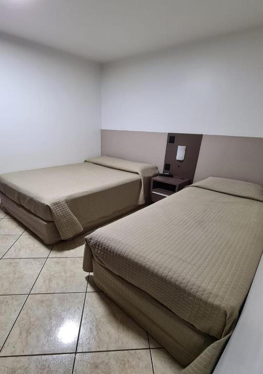 Postel nebo postele na pokoji v ubytování Hotel Nevada
