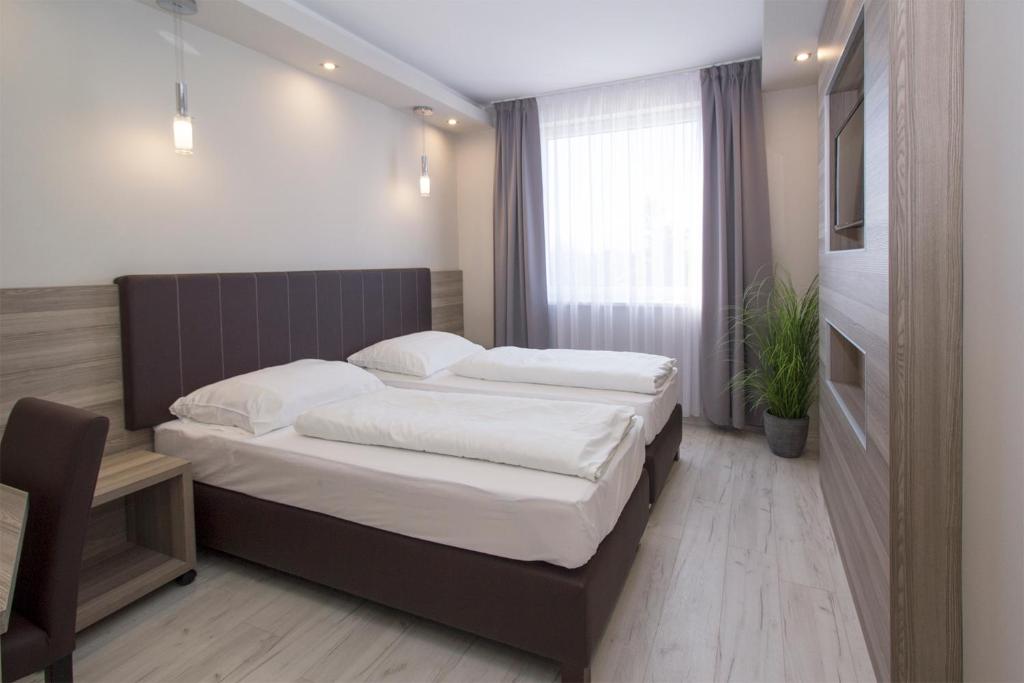 Postel nebo postele na pokoji v ubytování Dabas Hotel