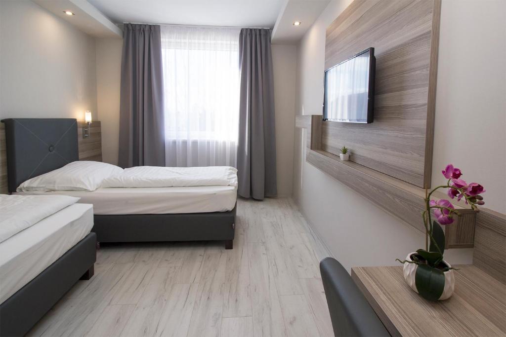 Postel nebo postele na pokoji v ubytování Dabas Hotel
