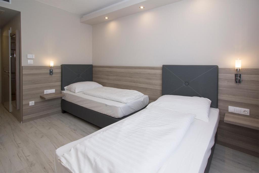 Postel nebo postele na pokoji v ubytování Dabas Hotel
