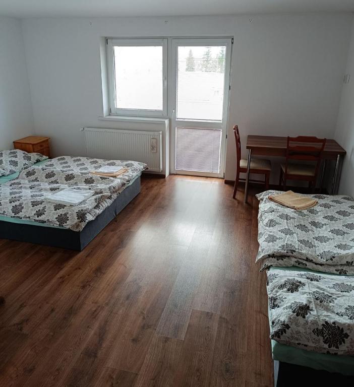 Postel nebo postele na pokoji v ubytování Apartmany Tatra Relax, Velky Slavkov
