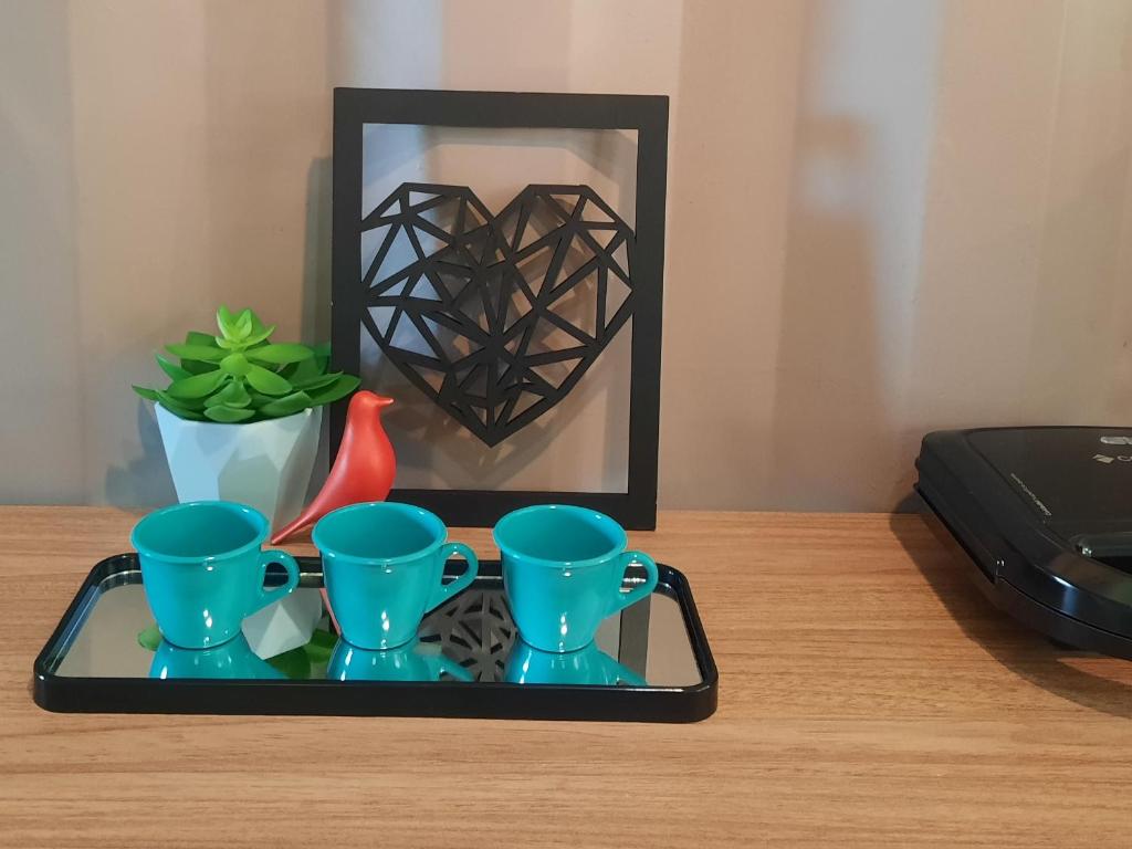 Nápoje v ubytování Apartamento Container com pátio, vaga para carro e Split