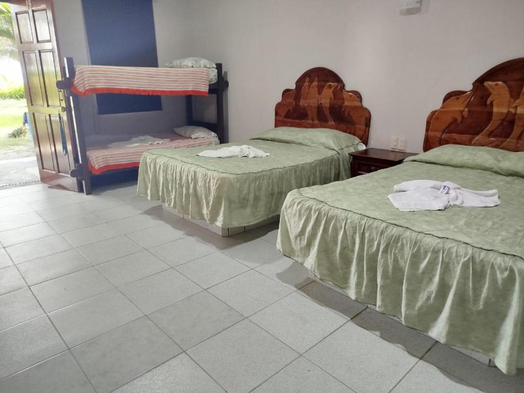 Postel nebo postele na pokoji v ubytování Playa Encantada