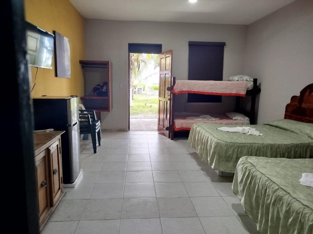 Postel nebo postele na pokoji v ubytování Playa Encantada
