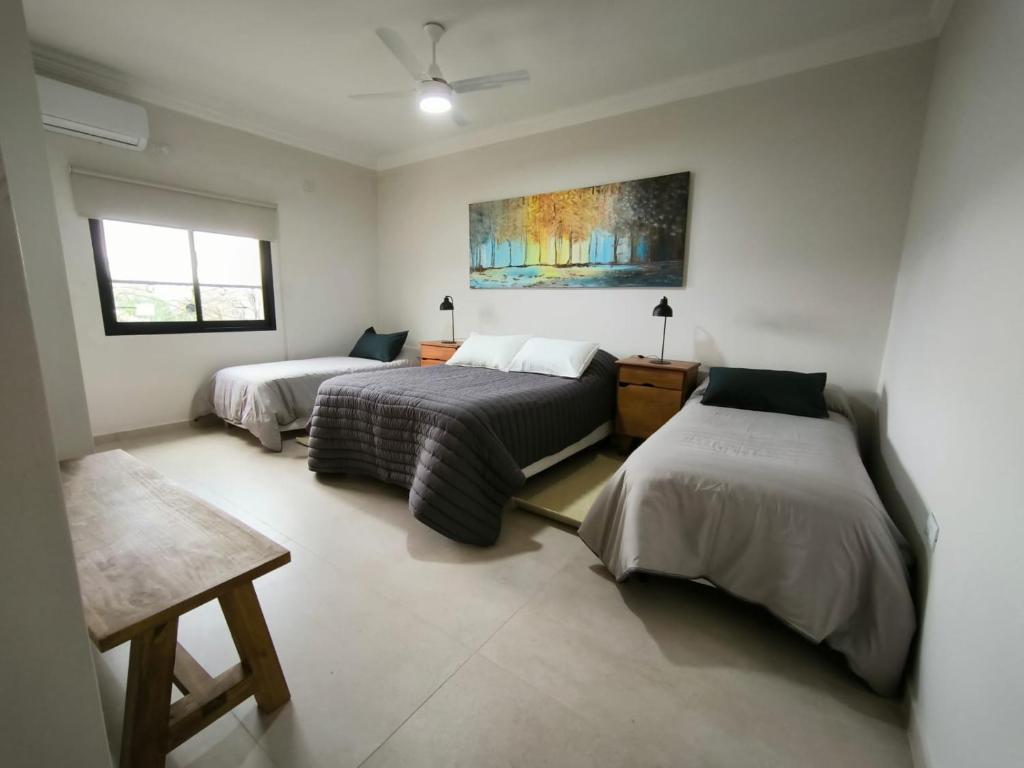 Ένα ή περισσότερα κρεβάτια σε δωμάτιο στο Habitación Cuádruple en Suite