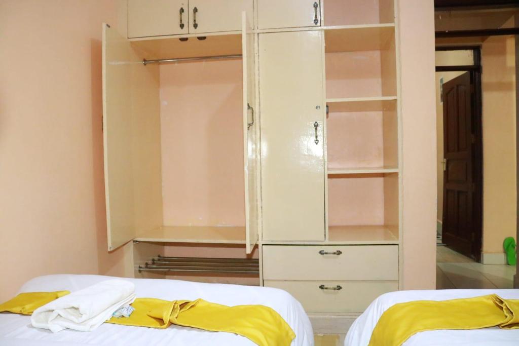 Postel nebo postele na pokoji v ubytování Elite stay