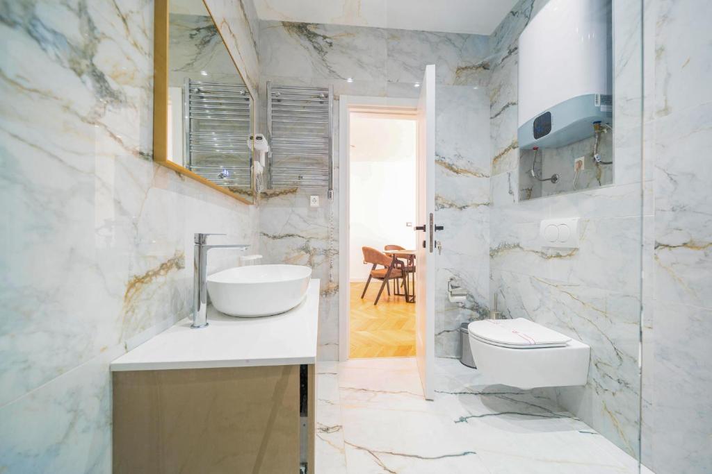 Koupelna v ubytování Exclusive Hotel