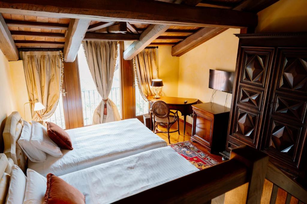 Letto o letti in una camera di Hotel Casa Pavesi
