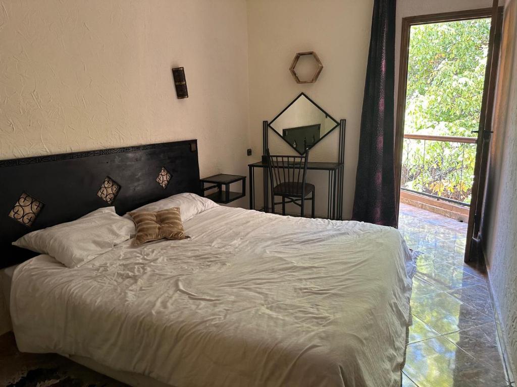 Postel nebo postele na pokoji v ubytování Kasbah Imoula
