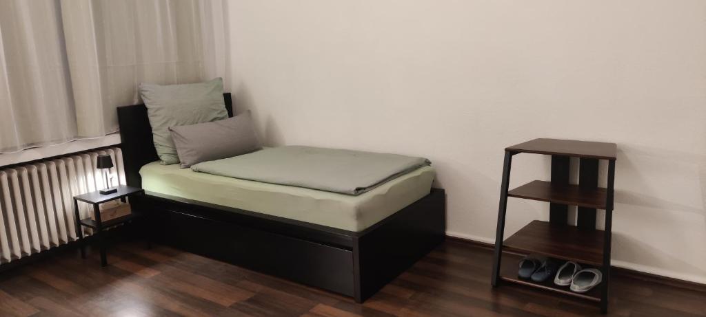 Postel nebo postele na pokoji v ubytování Gästezimmer Hildesheim