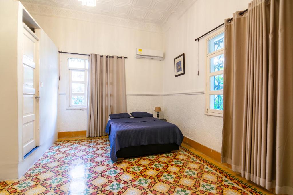 Postel nebo postele na pokoji v ubytování Casa Colonial en Manga