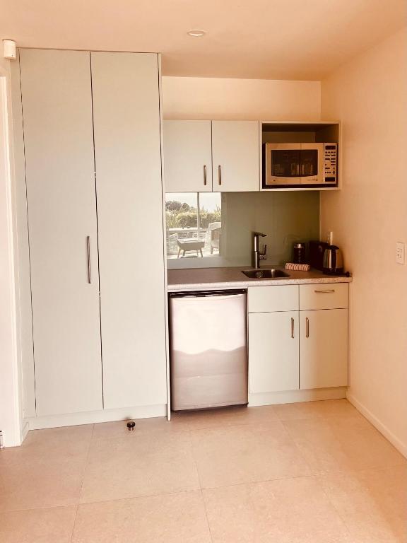 Kuchyň nebo kuchyňský kout v ubytování Watermark Apartments