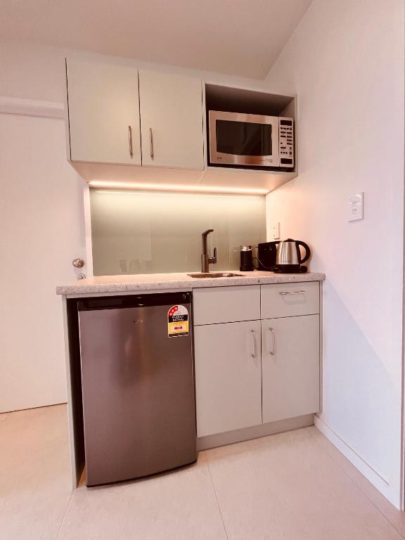 Kuchyň nebo kuchyňský kout v ubytování Watermark Apartments