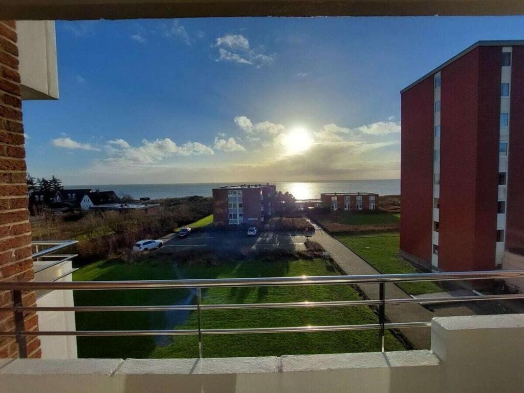 a view of the ocean from a balcony of a building at Föhrweh Comfortable holiday residence in Wyk auf Föhr