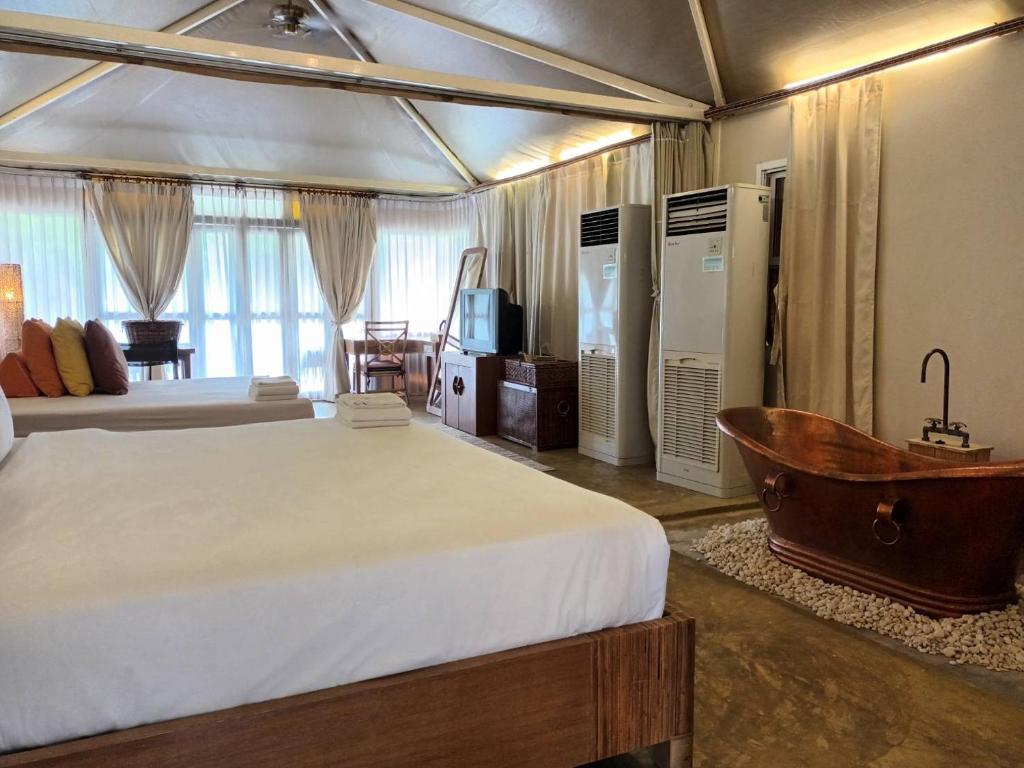 Postel nebo postele na pokoji v ubytování Pai Vimaan Resort