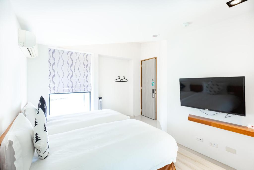 TV a/nebo společenská místnost v ubytování 野居海景渡假民宿Simple Life Home Stay