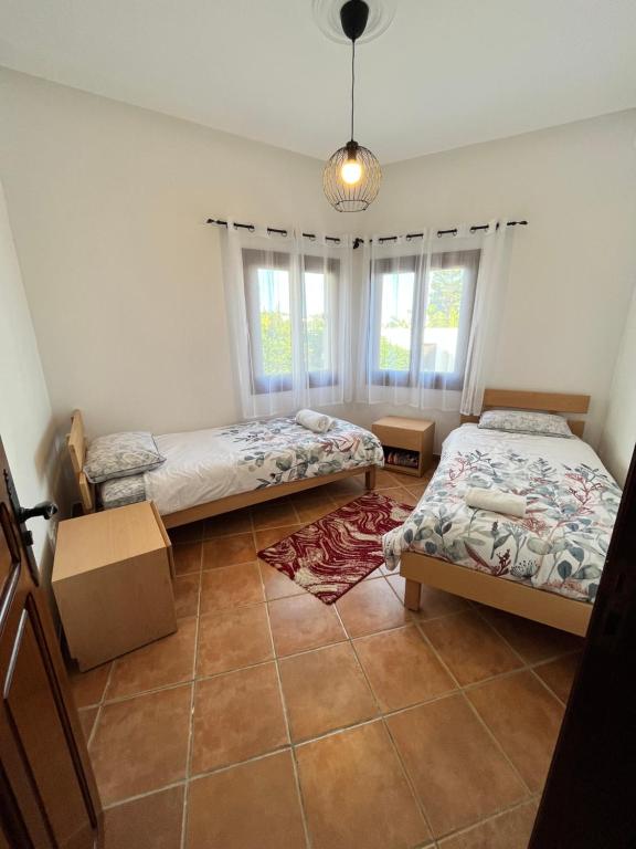 Postel nebo postele na pokoji v ubytování Appart magnifique Cabo Negro