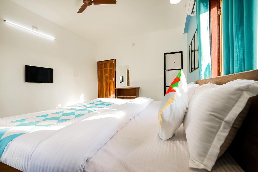 Postel nebo postele na pokoji v ubytování Hotel O Khan Basera