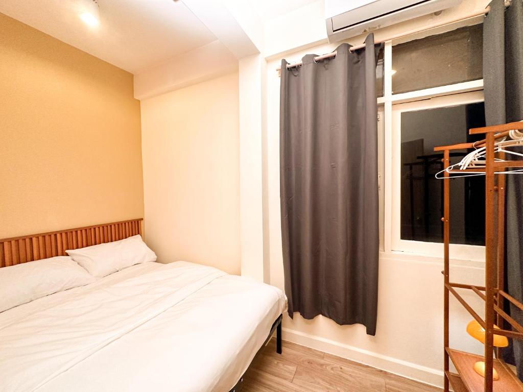 Postel nebo postele na pokoji v ubytování Bangkok Neighborhood Hostel