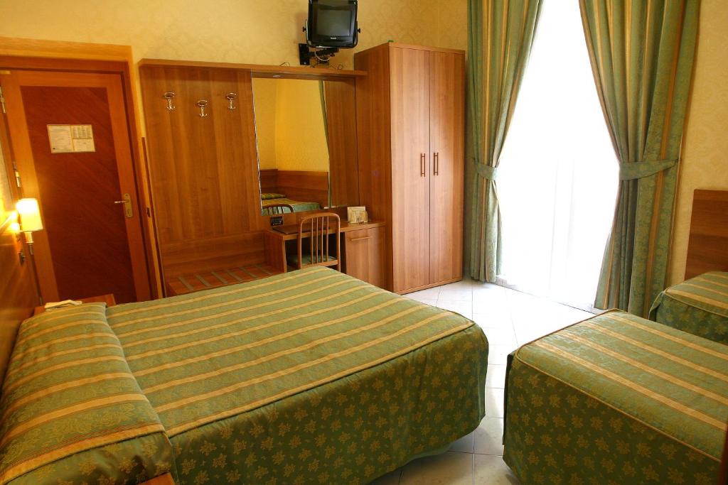 Postel nebo postele na pokoji v ubytování Hotel Teti
