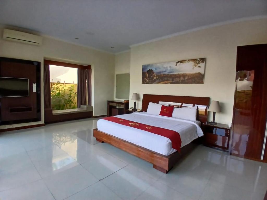 En eller flere senge i et værelse på Villa Putri in Seminyak Bali