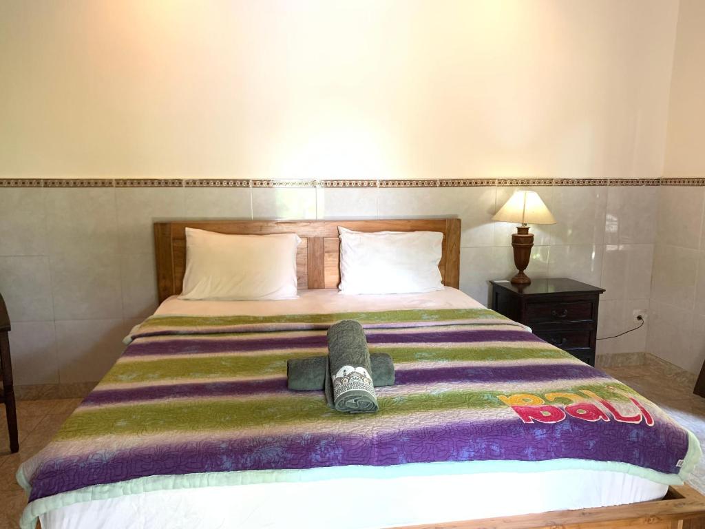 Postel nebo postele na pokoji v ubytování Bagus Homestay