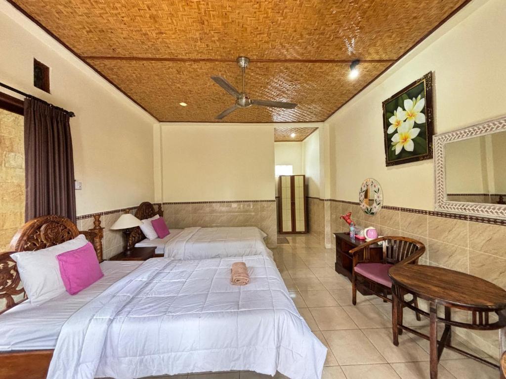 Postel nebo postele na pokoji v ubytování Bagus Homestay