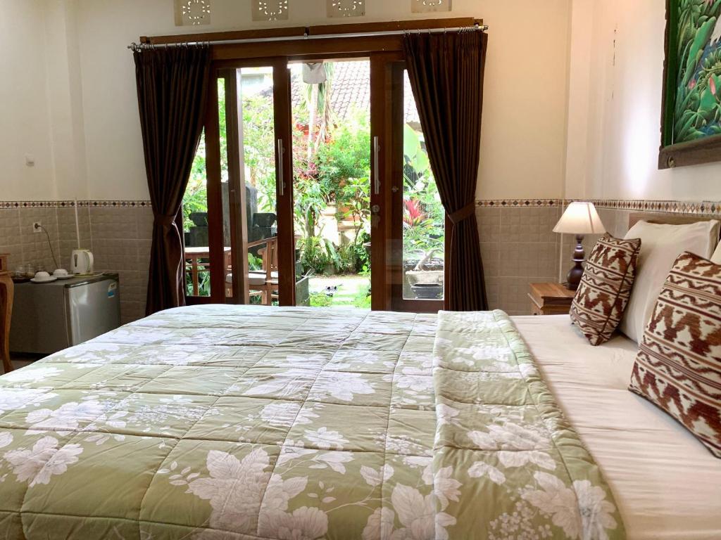 Postel nebo postele na pokoji v ubytování Bagus Homestay