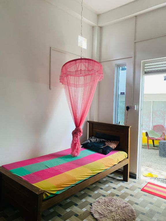 Postel nebo postele na pokoji v ubytování Pick Me Village