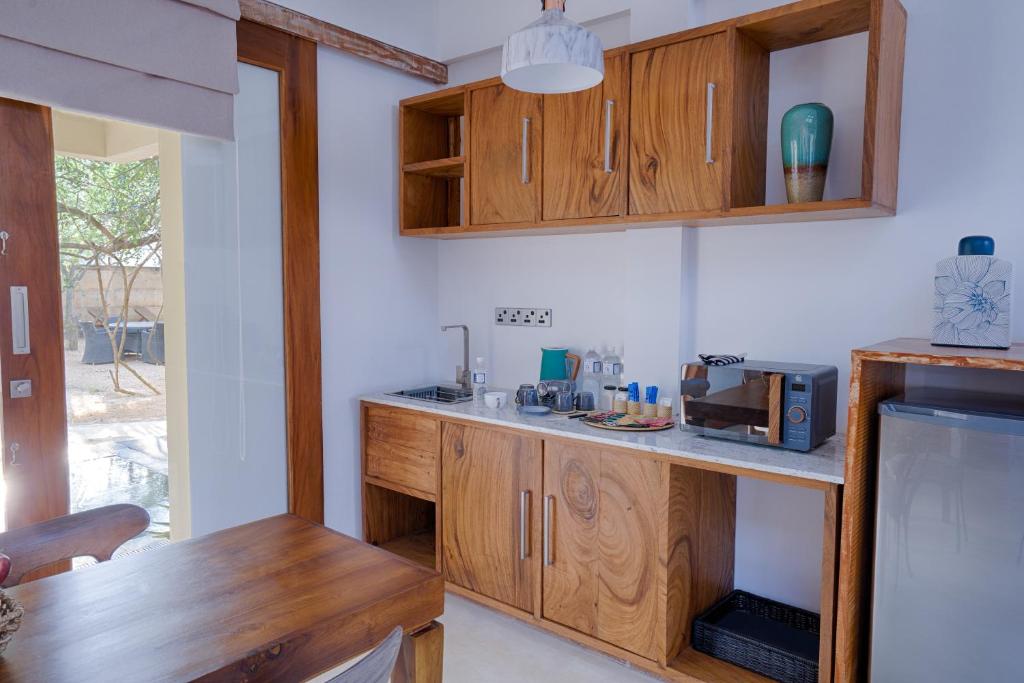 Kuchyň nebo kuchyňský kout v ubytování O2 Villas Yala