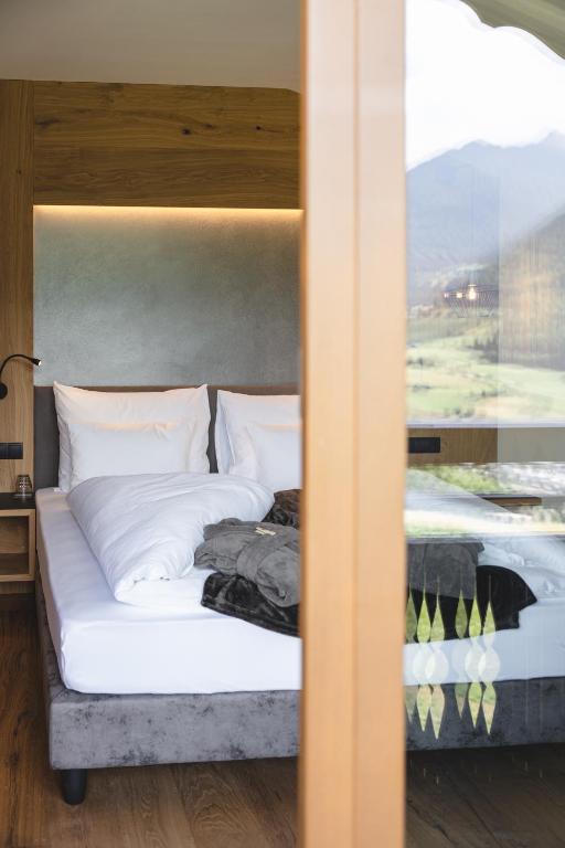 Postel nebo postele na pokoji v ubytování Hotel Lahnerhof