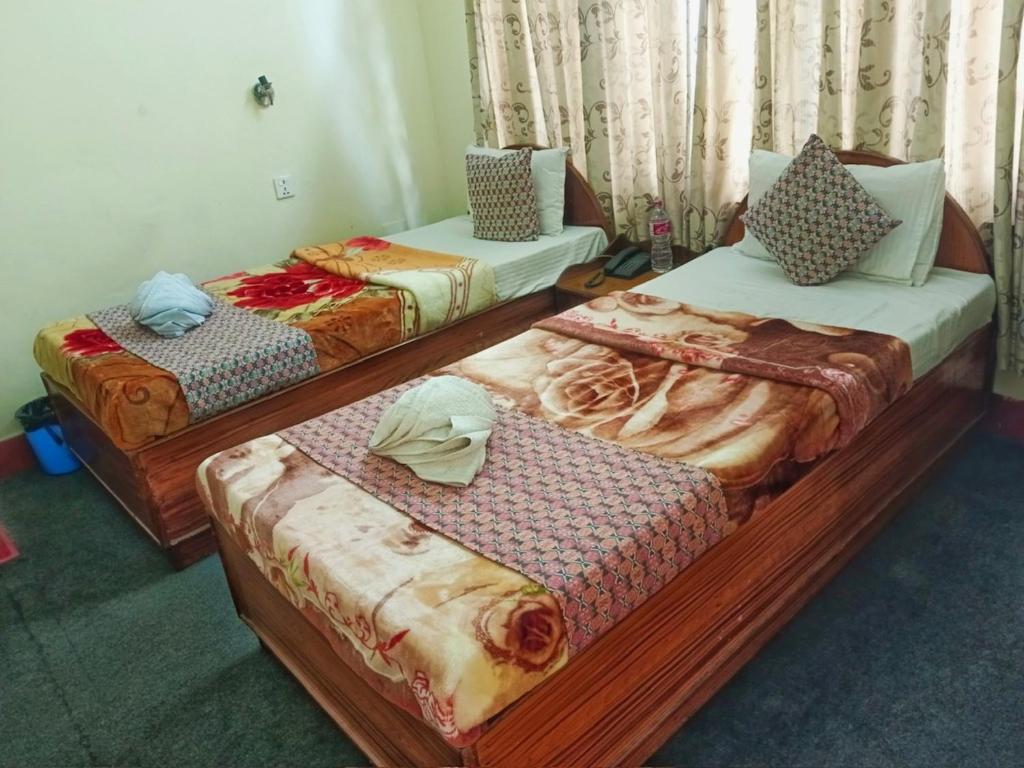 Postel nebo postele na pokoji v ubytování Hotel Blue Magnet