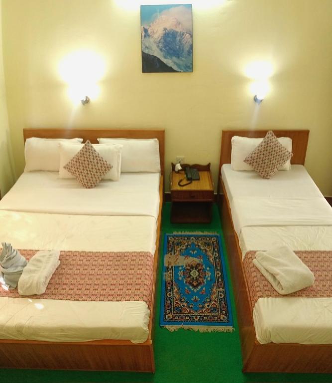 Postel nebo postele na pokoji v ubytování Hotel Blue Magnet