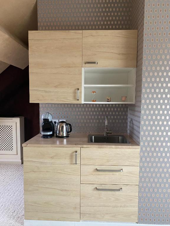 Kuchyň nebo kuchyňský kout v ubytování La chambre de Mathilde