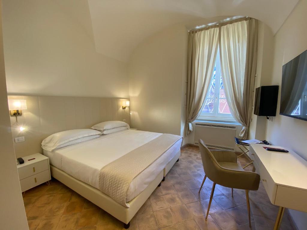 TV a/nebo společenská místnost v ubytování Basilica Hotel