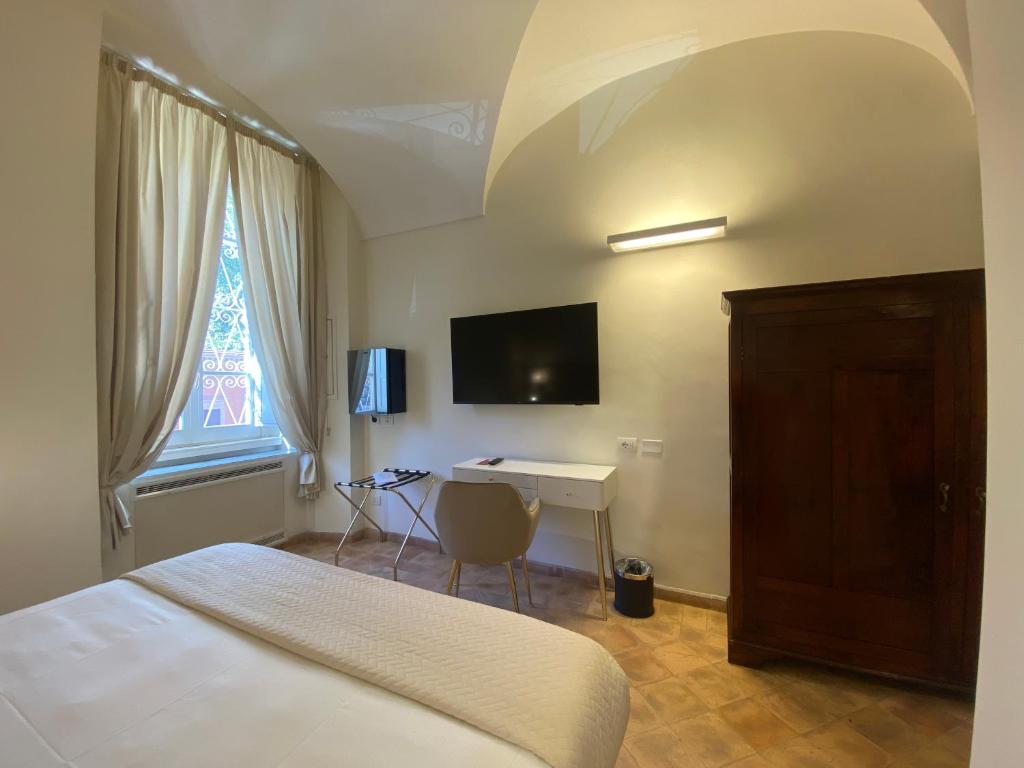 Postel nebo postele na pokoji v ubytování Basilica Hotel