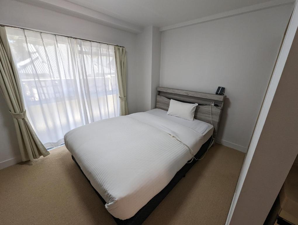 Postel nebo postele na pokoji v ubytování Hotel WWJ