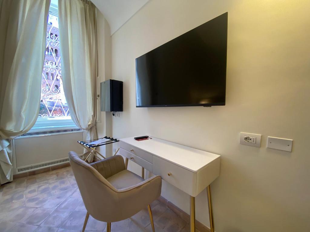 TV a/nebo společenská místnost v ubytování Basilica Hotel
